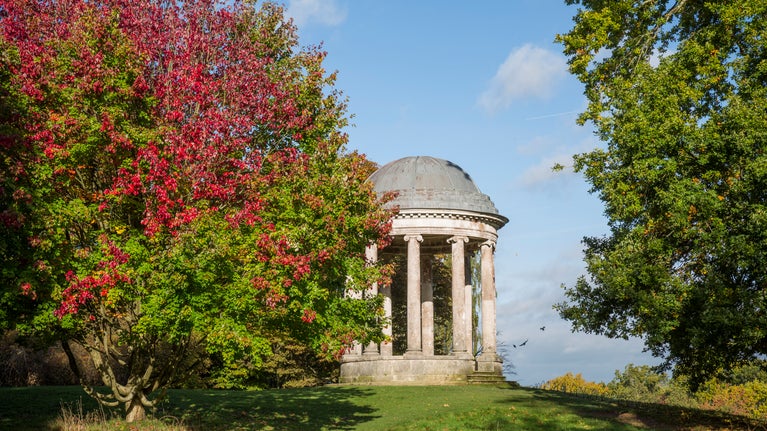 The Ionic Rotunda surrounded with autumnal trees at Petworth, West Sussex